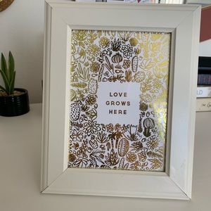 LOVE GROWS HERE gold print